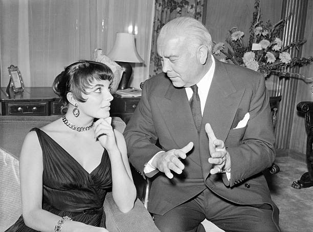 Joan Collins, Spyros Skouras