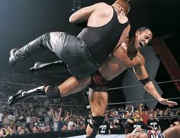 Picture of The Undertaker vs The Rock vs Kurt Angle (WWE, Vengeance 2002)